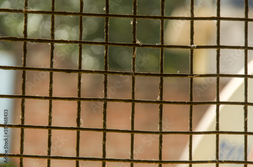 Metal grid background, blurred bokeh background .