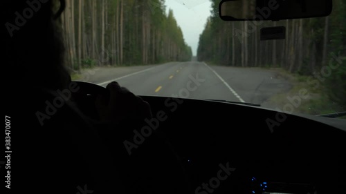 Driving through the pine forest in western Wyoming near Yellowstone. photo