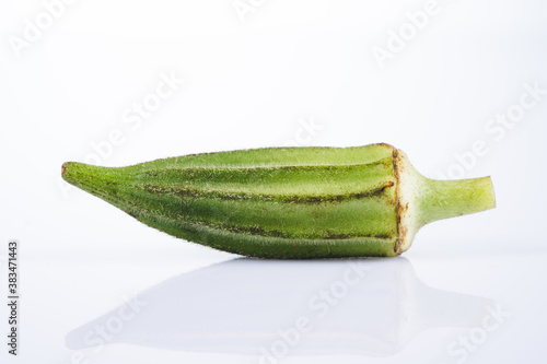 Fresh okra on white background photo