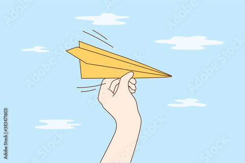 Travelling, business, delivery, flight concept. Man woman cartoon hands hold handmade paper plane flying in sky demonstrating email letter delivering. Leisure games and travel journey illustration.