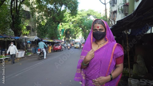 Indian Woman Wearing Face Mask to Protect Herself from Harmful Viruses and Pollution during the Covid-19 pandemic photo