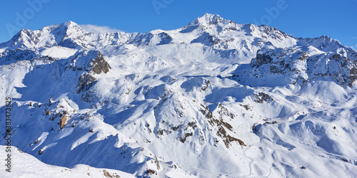 Panoramic view of the mountain range near Tignes high-altitude ski resort in France during the winter season.