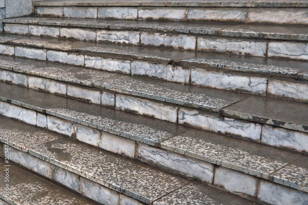 Close up stone steps texture. Close-up of steps covered with raindrops. Close up stone steps texture. Close-up of steps covered with raindrops.