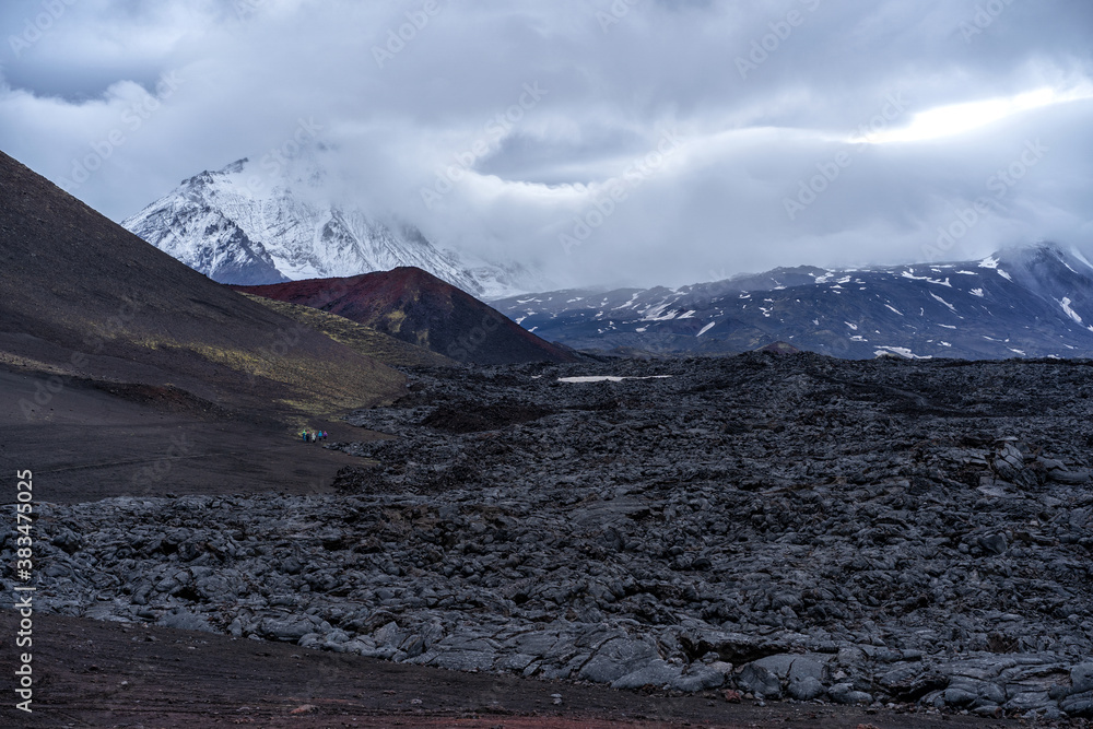 Active lava flow against the background of the Ostry Tolbachik volcano - Kamchatka, Russia.