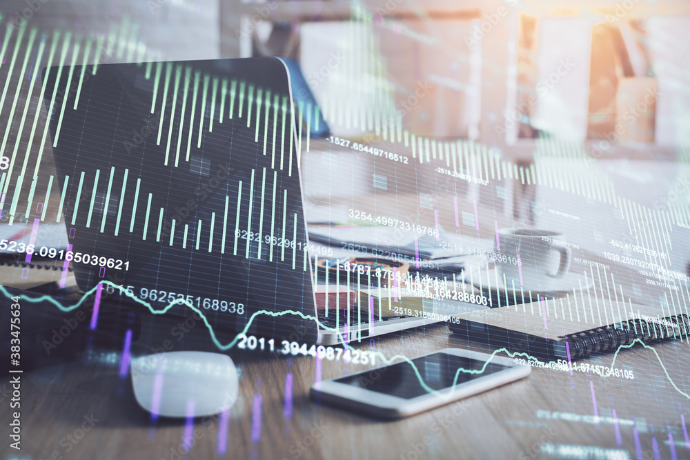 Financial chart drawing and table with computer on background. Double exposure. Concept of international markets. Financial chart drawing and table with computer on background. Double exposure. Concept of international markets.