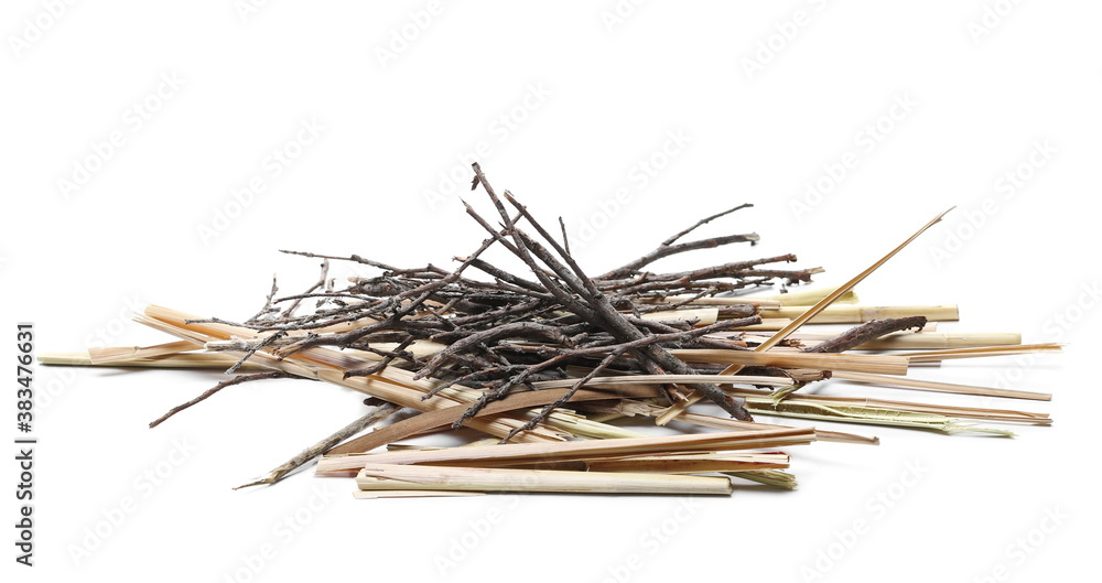 Dry twigs and straw pile isolated on white background