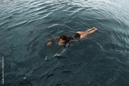 High angle view of woman floating on the water