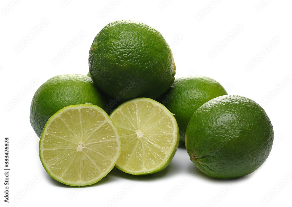Green limes with sliced halves isolated on white background Green limes with sliced halves isolated on white background