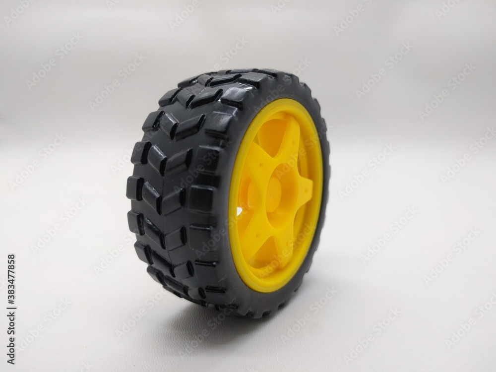 wheel toy with black and yellow on a white background close