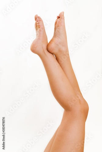 Female legs on a white background