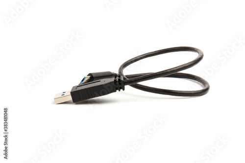 USB cable close up on white background. Charge, plugging, equipment and electricity