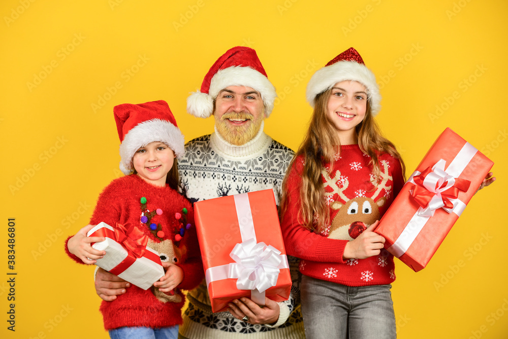Christmas fun. bearded santa man with kids. knitted fashion for winter. new year shopping. time for presents. happy family celebrate xmas. small girls exchange gifts with father. dad love daughters Christmas fun. bearded santa man with kids. knitted fashion for winter. new year shopping. time for presents. happy family celebrate xmas. small girls exchange gifts with father. dad love daughters
