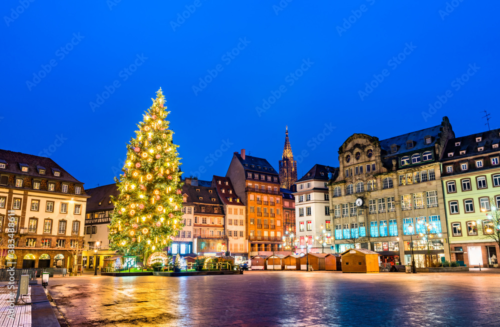 Christmas tree at the famous Christmas Market in Strasbourg at night - Alsace, France