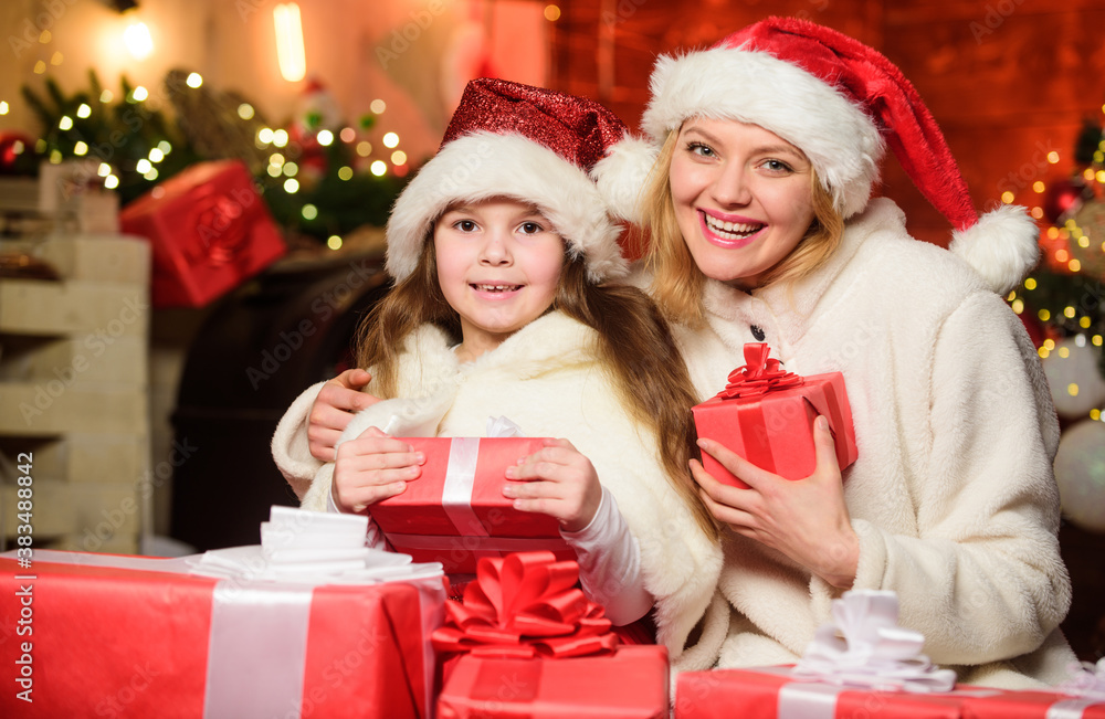 joy and cheer. Happy family celebrate new year. merry christmas. mother and daughter love holidays. small child girl with mom in santa hat. xmas gift boxes. Open present. Winter shopping sales joy and cheer. Happy family celebrate new year. merry christmas. mother and daughter love holidays. small child girl with mom in santa hat. xmas gift boxes. Open present. Winter shopping sales