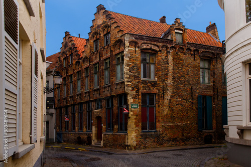 Bruges, Flanders, Belgium, Europe - October 1, 2019. Medieval old brick houses on the ancient streets in Bruges (Brugge) in autumn