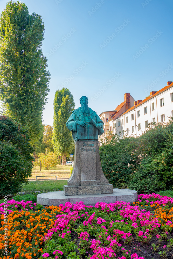 Monument for Johann Gutenberg, German inventor who developed mechanical type printing press to print books in historical and shopping downtown in Magdeburg, Germany, early Autumn.