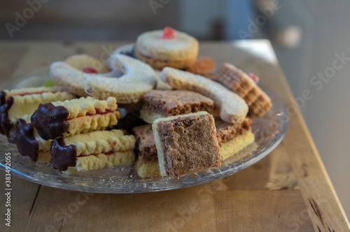 Group of delicious sweet Christmas cookies, white vanilla rolls, gingerbread, linzer and chocolate sweets wiht jam filling