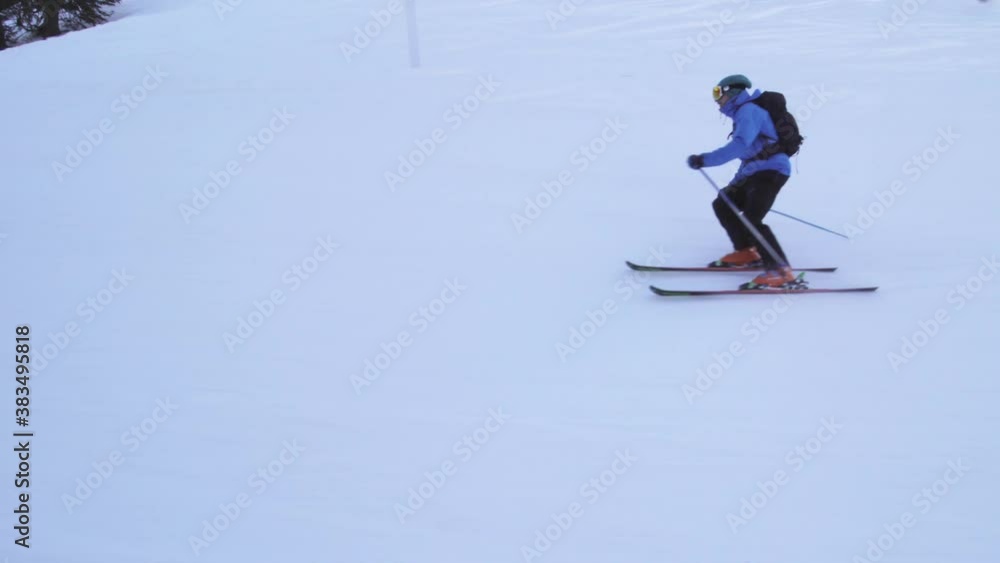Professional advanced skier skiing on slopes in the Swiss alps Professional advanced skier skiing on slopes in the Swiss alps