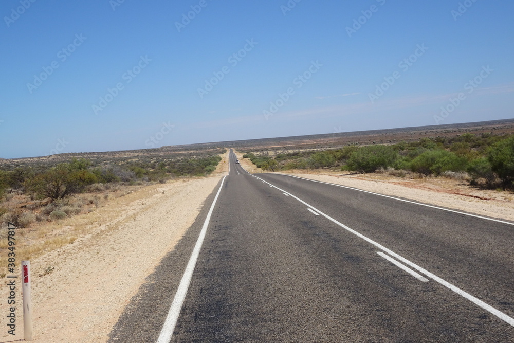 Roadtrip on empty straight road in Western Australia