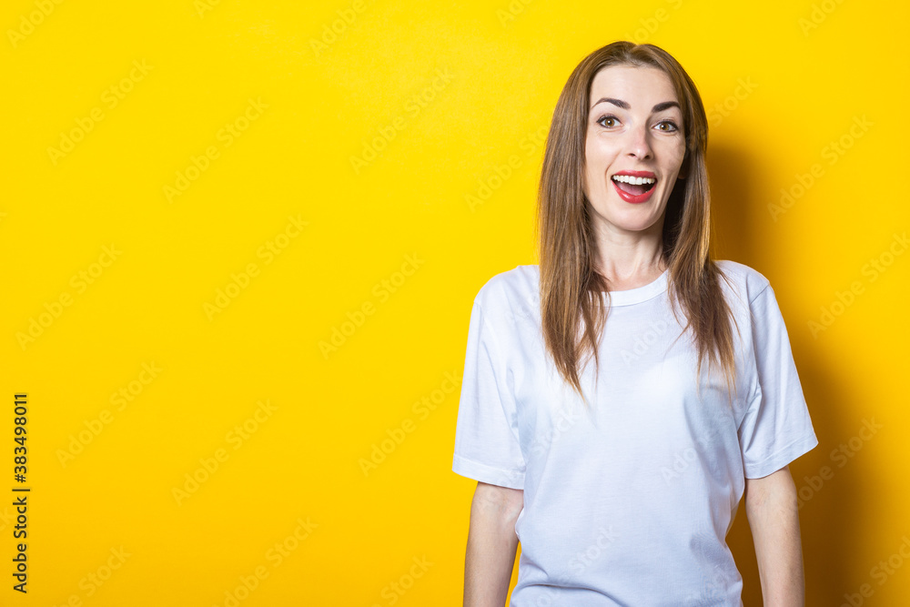 Young woman with a smile dressed in a white casual T-shirt on a yellow background. Banner Young woman with a smile dressed in a white casual T-shirt on a yellow background. Banner