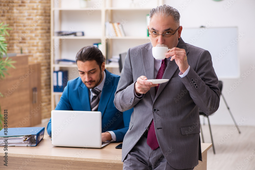 Two male colleagues working in the office
