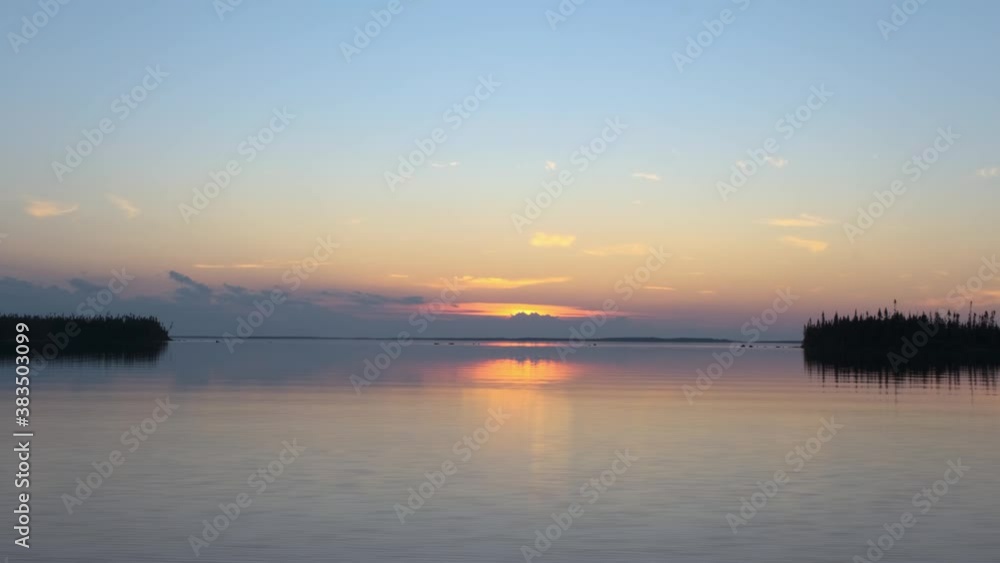 Splendid colourful sunset scene on a quiet lake in Canada Splendid colourful sunset scene on a quiet lake in Canada
