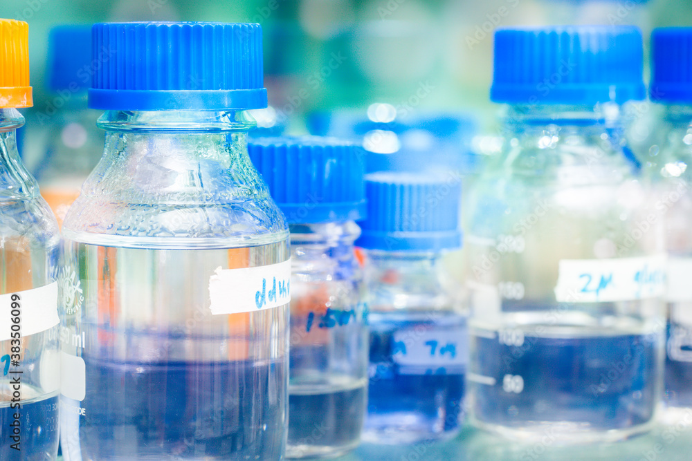 Rows of liquid chemicals in bottles at chemistry Rows of liquid chemicals in bottles at chemistry