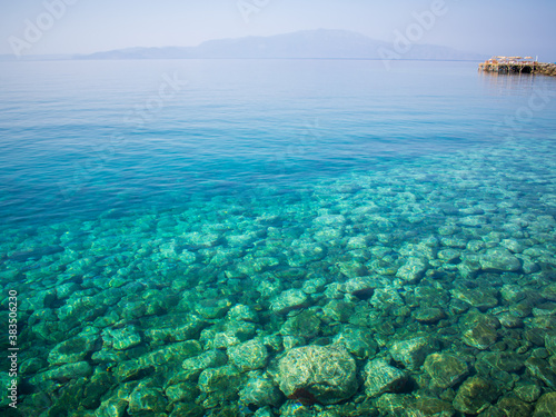 The turquoise color of the sea and the stones at the bottom