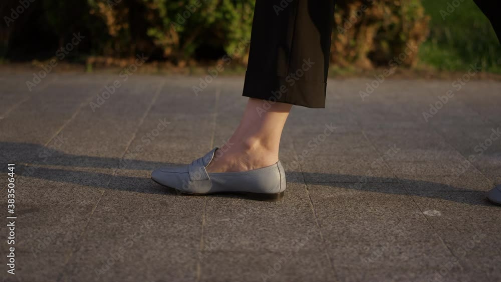 . Mature girl walking on the asphalt of a city street. Business concept, office employee. Close-up of business woman legs running. High quality 4k footage . Mature girl walking on the asphalt of a city street. Business concept, office employee. Close-up of business woman legs running. High quality 4k footage
