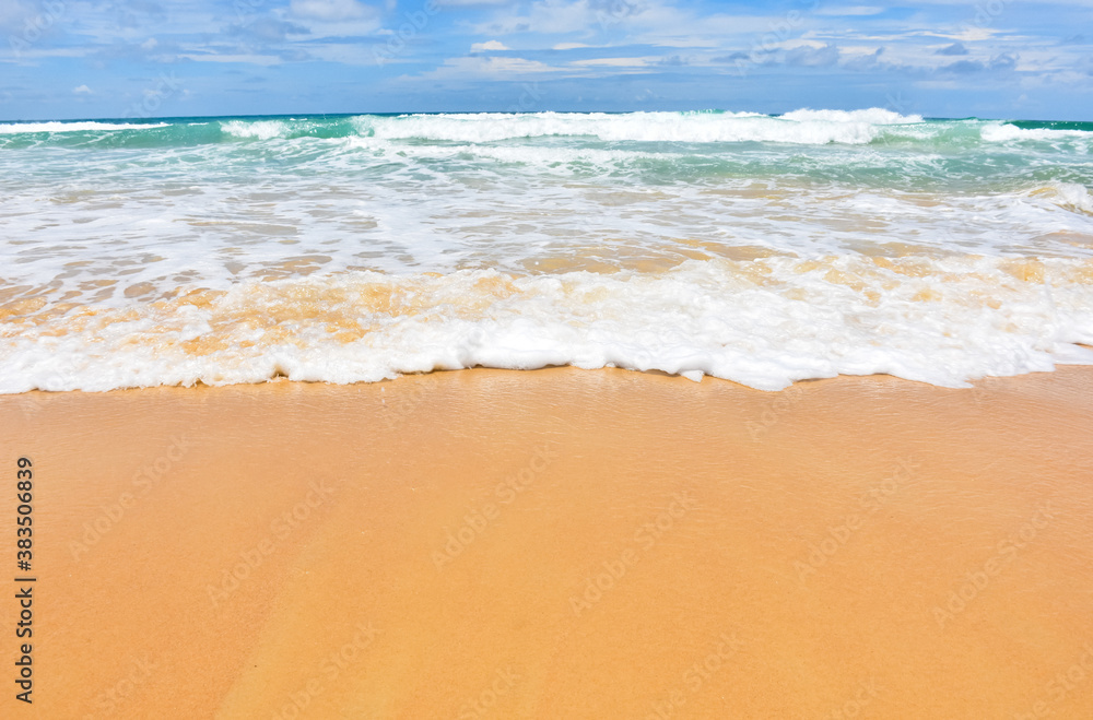 The smooth sandy beach with beautiful waves as the background. The smooth sandy beach with beautiful waves as the background.