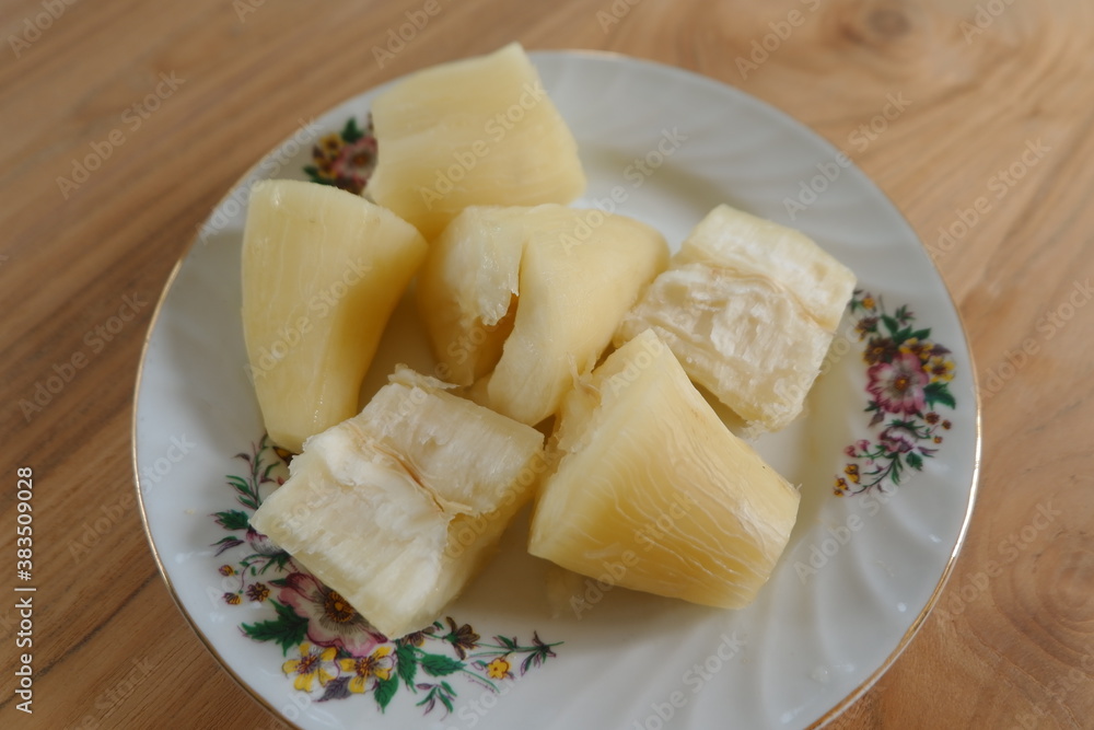 Steamed cassava served on a plate