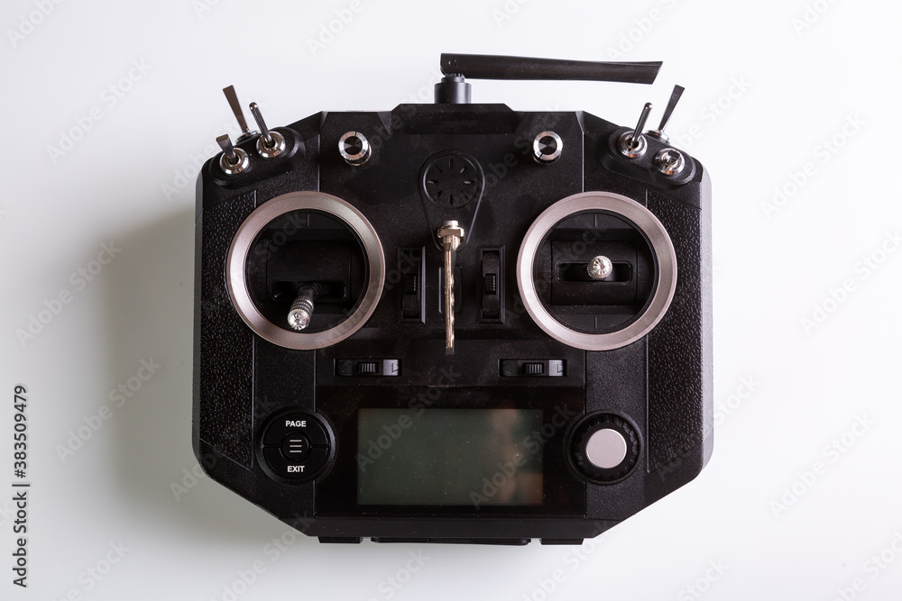 Black remote control for drone. Top view on white background. Horizontal orientation. High quality photo