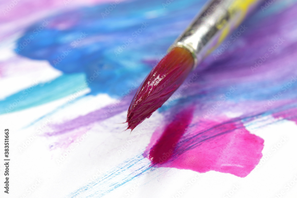 Fototapeta premium close-up brush and paint on colored background