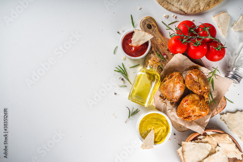 Roasted chicken legs or wings. Grill roasted spicy legs or wings,with various sauces and spices, copy space