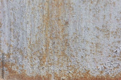 old rusty texture of cracked white paint The old cracked paint on a wall surface