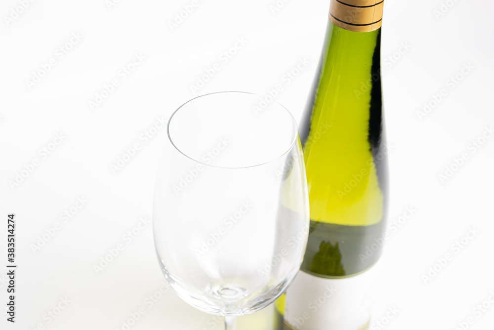 Bottle of white wine and glasses isolated on white Bottle of white wine and glasses isolated on white