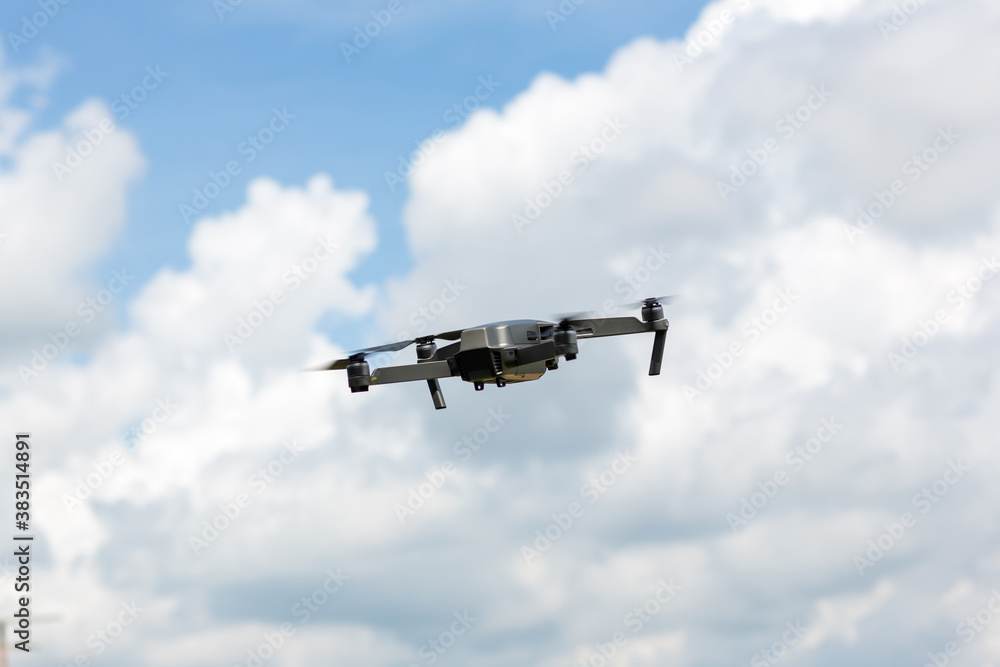 Drone copter flying with digital camera.Drone with high resolution digital camera. Flying camera take a photo and video.The drone with professional camera takes pictures of the misty mountains.