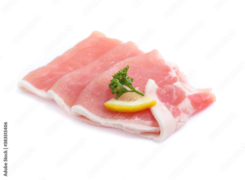 Raw pork meat with parsley herb leaves isolated on white background Raw pork meat with parsley herb leaves isolated on white background