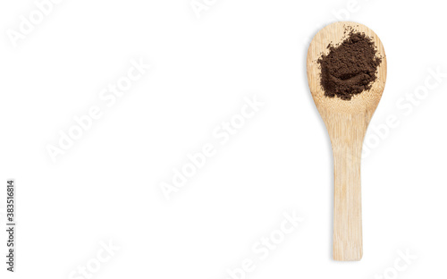 Wooden spoon filled with ground coffee isolated on white background with space to write