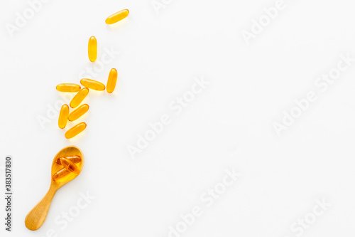 Fish oil supplement capsules and omega 3, top view