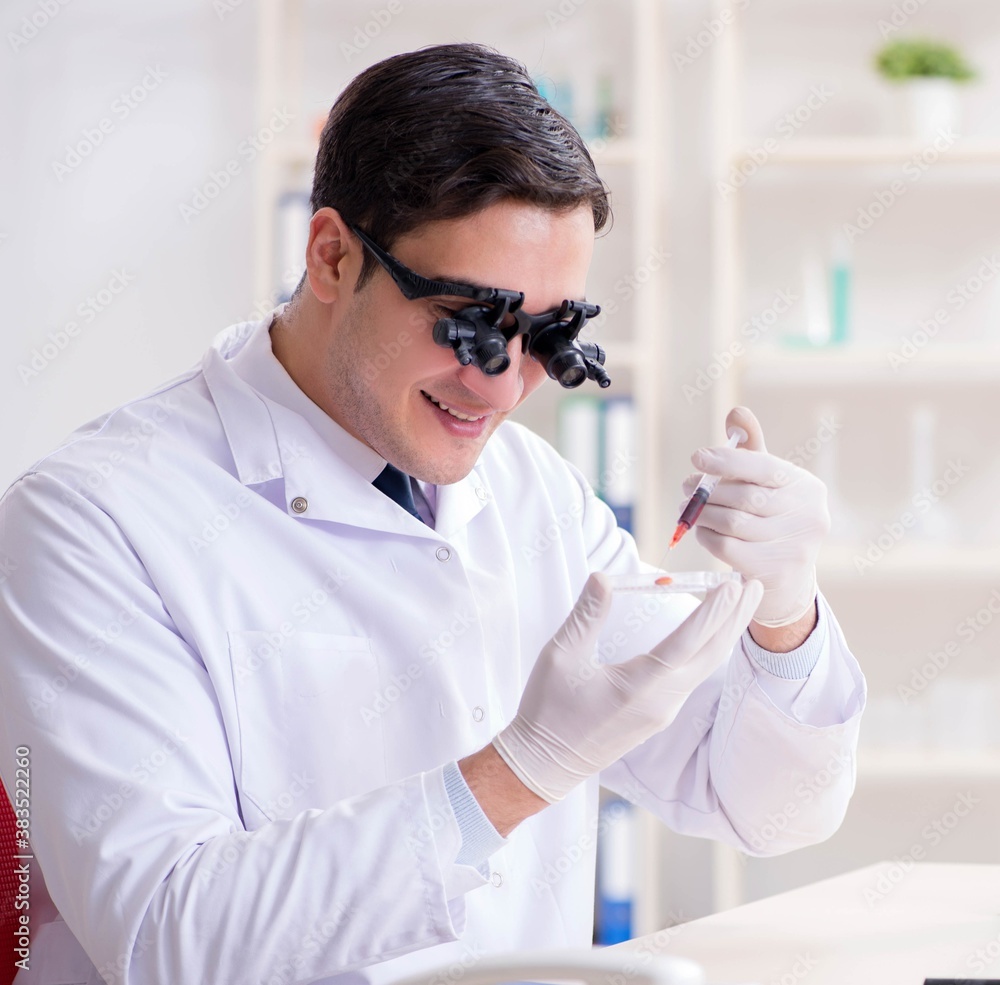 Doctor chemist working on blood samples in lab Doctor chemist working on blood samples in lab