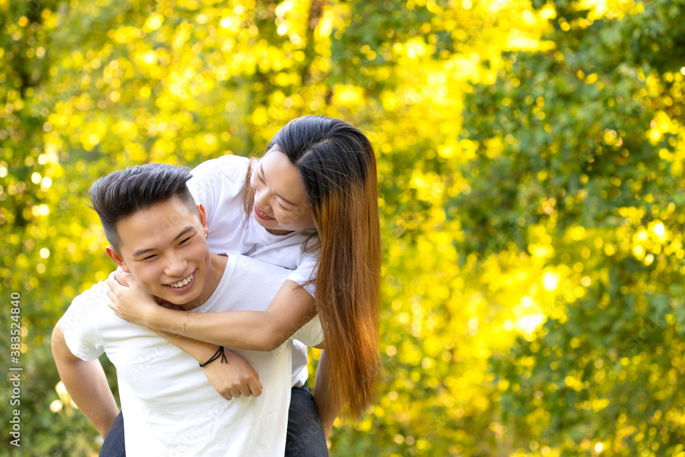 a boy and a girl have fun in the park at sunset a boy and a girl have fun in the park at sunset