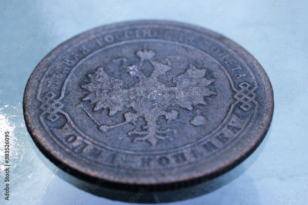 The coat of arms of tsarist Russia on the reverse side of a copper coin one kopeck of 1904. The coat of arms of tsarist Russia on the reverse side of a copper coin one kopeck of 1904.