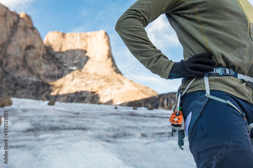 Side view of climber wearing a harness. photo