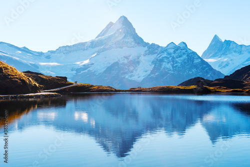 Bachalpsee lake in Swiss Alps mountains. Snowy peaks of Wetterhorn, Mittelhorn and Rosenhorn on background. Grindelwald valley, Switzerland. Landscape photography © Ivan Kmit