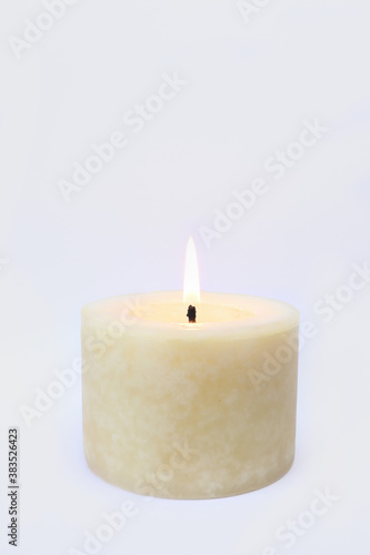 aromatic scented ivory lighting round pillar candle is isolated on white background