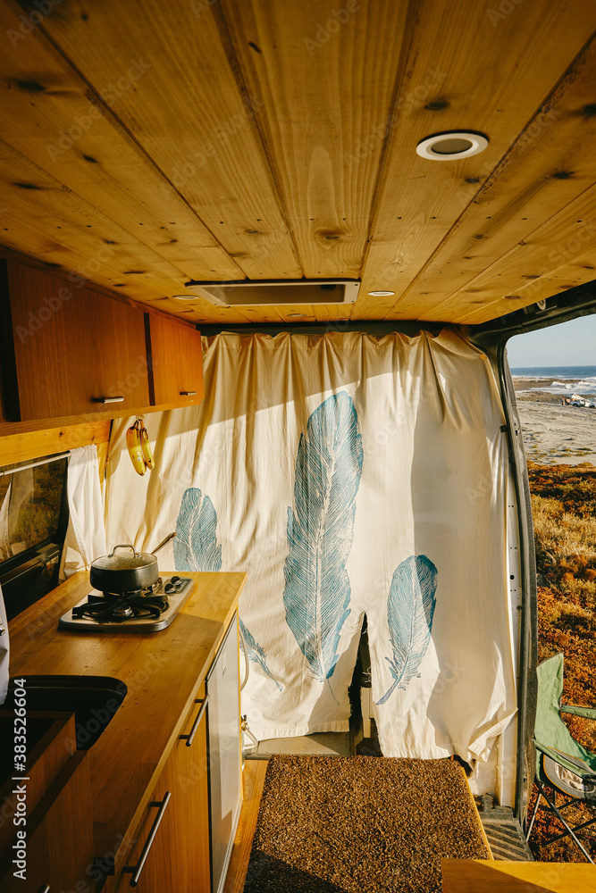 Interior of camper van parked on cliff during sunset in Baja, Mexico. Interior of camper van parked on cliff during sunset in Baja, Mexico.