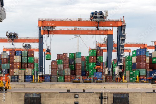 Containers and gantry cranes in the Port of Rotterdam. ROTTERDAM, THE NETHERLANDS - AUG 23, 2017.