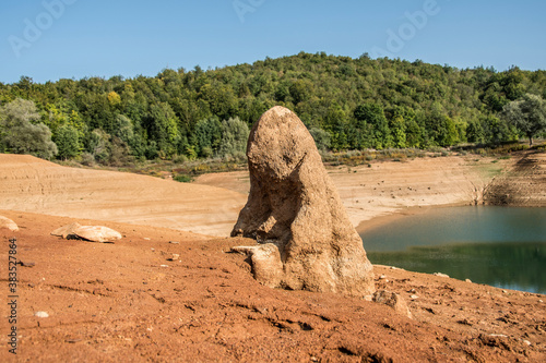 Kruscica lake is the accumulation lake that was built by damming Lika river. It has eighty-meter-high dam and on the bottom of the lake in its depths lies a sunken village and the church of St. Eliah photo