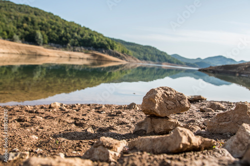 Kruscica lake is the accumulation lake that was built by damming Lika river. It has eighty-meter-high dam and on the bottom of the lake in its depths lies a sunken village and the church of St. Eliah photo